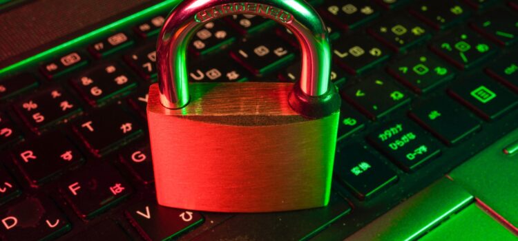 6 Steps to Effective Vulnerability Management for Your Technology red padlock on black computer keyboard