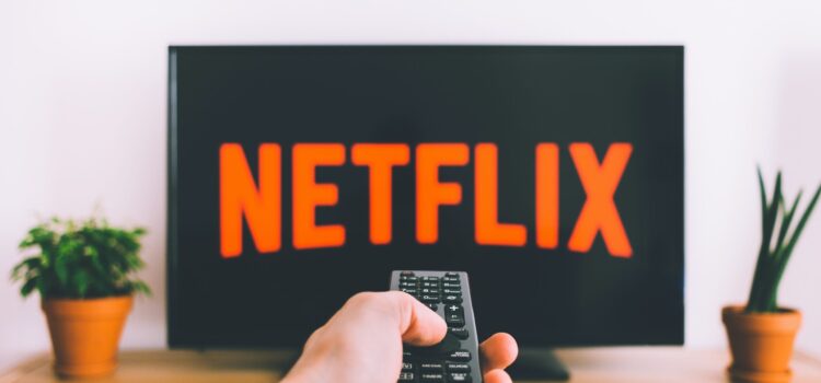 Free Person Holding a Remote Control Stock Photo