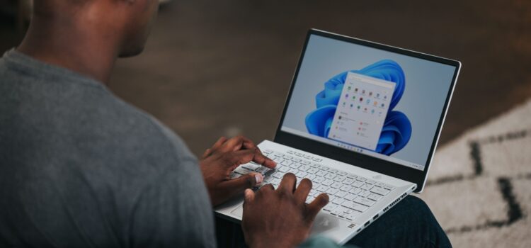 How to Create Insightful Dashboards in Microsoft Power BI man in gray long sleeve shirt using Windows 11 computer