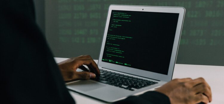 7 Advantages of Adopting a Defense-in-Depth Cybersecurity Strategy Free Person Using Macbook Air Stock Photo