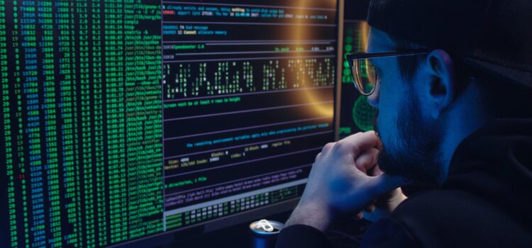 Top Data Breaches of 2023: Numbers Hit an All-Time High Free A Man Looking at a Computer Screen with Data Stock Photo
