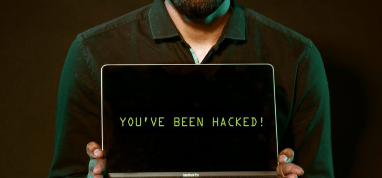 9 Signs That Your Smart Home Device Has Been Hacked Free Man Holding Laptop Computer With Both Hands Stock Photo