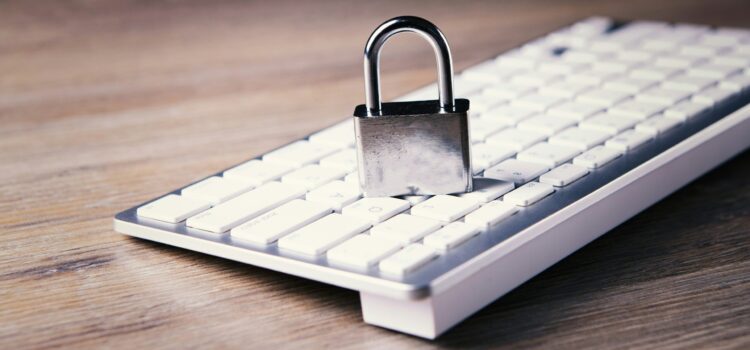 Your 2025 Privacy Compliance Checklist and What You Need to Know About the New Data Laws a computer keyboard with a padlock on top of it