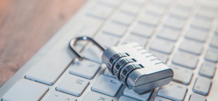 Stop Ransomware in Its Tracks: A 5-Step Proactive Defense Plan A combination lock rests on a computer keyboard.