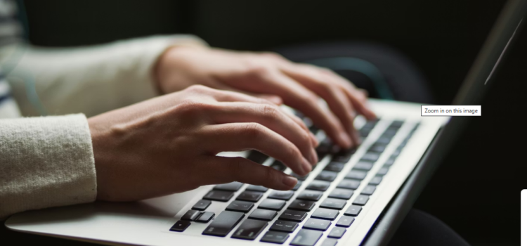 Stop the Bleeding: How Revoking Admin Rights Eliminates Support Tickets Person using laptop photo