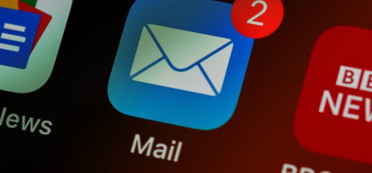 How to Stop Scammers from Sending Emails in Your Company’s Name closeup of mail app icon on phone