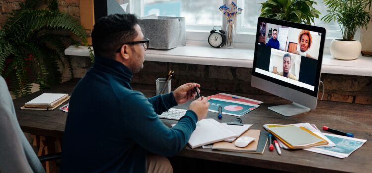 teacher-video-calling-with-his-students-using-a-computer