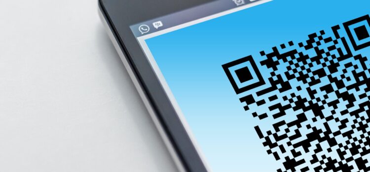 QR Code Scams: What They Are and How to Protect Your Business Free High-resolution close-up of a smartphone displaying a QR code on its screen. Stock Photo