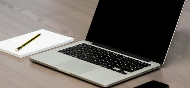 Free Silver Macbook Beside Iphone Stock Photo